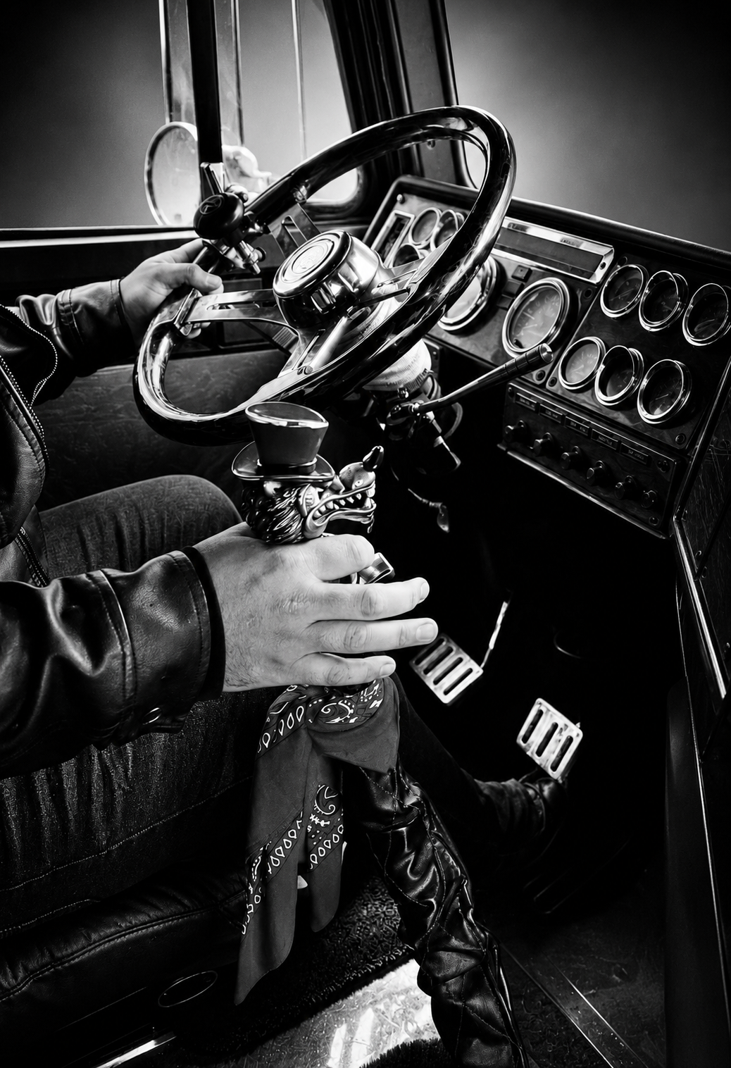 Inside the cab — driver's hands on the wheel and gear shift